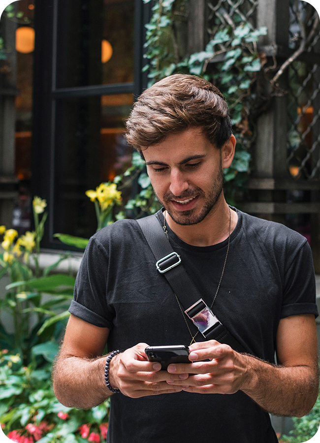 Man Holding Phone on New York Street