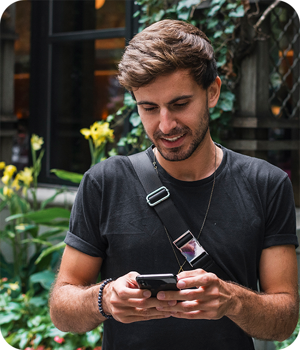 Man Holding Phone on New York Street