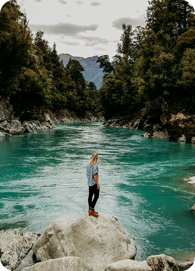 Man Standing on Rock Hokitika Gorge New Zealand