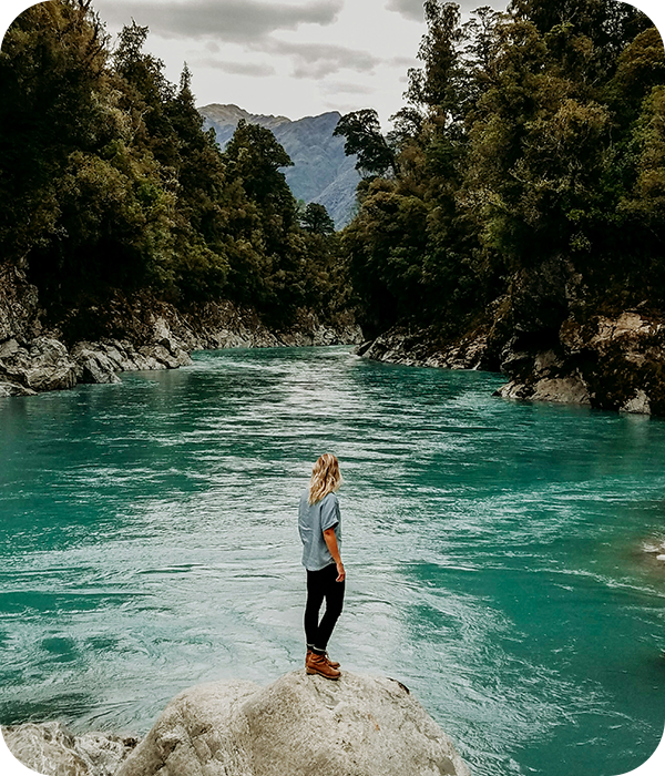 Man Standing on Rock Hokitika Gorge New Zealand