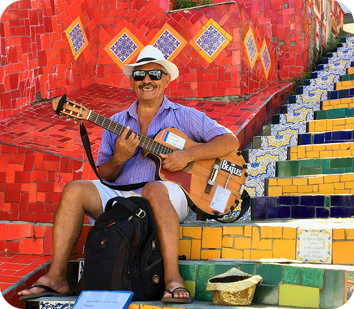 Man with Guitar Sitting on Escadaria Selarón