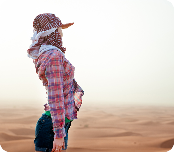 Young Woman Looking Out To Vast Desert